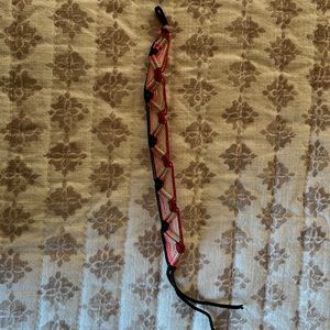 pink red white black bracelet